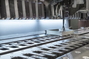 metal stamping machine up close in action